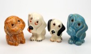 Four "Sad Dog" porcelain statues by CROWN DEVON and others, 20th century, the largest 10cm high