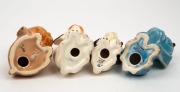 Four "Sad Dog" porcelain statues by CROWN DEVON and others, 20th century, the largest 10cm high - 2