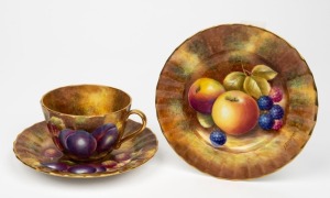 ROYAL WORCESTER English porcelain teacup, saucer and plate set with hand-painted fruit design signed "Leaman", black factory mark to base, the plate 15.5cm diameter