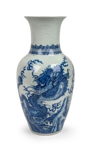 An antique Chinese blue and white porcelain vase with dragon and wave decoration, 19th/20th century, Kangxi leaf mark to base, 42.5cm high
