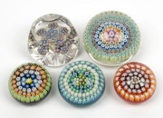 CRIEFF group of five Scottish millefiori glass paperweights including a faceted example, all bearing original labels, the largest 4cm high, 6.5cm wide