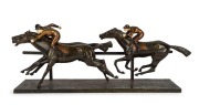 MAURICE GUIRAUD RIVERE&nbsp;(1881-1947), Horse Racing patinated cast bronze with carved ivory face and hand details, early 20th century, 30cm high, 86cm long, 20cm deep