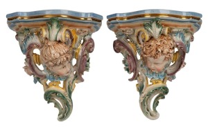 HUGO LONITZ pair of German porcelain wall brackets adorned with faces, 19th century, impressed double fish mark and stamped "Made In Germany", 34cm high