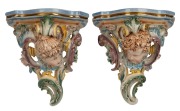HUGO LONITZ&nbsp;pair of German porcelain wall brackets adorned with faces, 19th century, impressed double fish mark and stamped "Made In Germany", 34cm high
