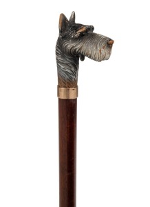 An antique walking stick carved and polychrome finished dog's head handle with mouth opening mechanism, gold finished collar, timber shaft and brass ferrule, 87cm high