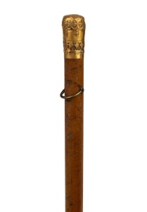 An antique walking stick with high carat yellow gold top, Malacca cane and brass ferrule, 19th century, 83cm high