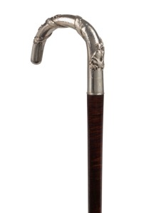 An antique walking stick with impressive Chinese silver handle with dragon decoration by LUEN HING of Shanghai with snake-wood shaft and brass ferrule, 19th century, 92cm high