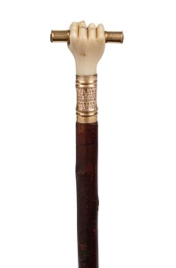An antique lady's walking stick with 18ct yellow gold and carved ivory fist handle, blackthorn shaft and brass ferrule, 86cm high