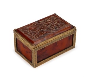 An antique Chinese gilt bronze and carved amber box, Qing Dynasty, 19th century, seal mark to base, 4.5cm high, 8.5cm wide, 5.5cm deep
