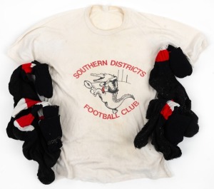 ex NATHAN BUCKLEY COLLECTION: Southern Districts Football Club white T-shirt with caricatured crocodile kicking a footy.