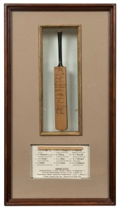 M.C.C. TOUR OF NEW ZEALAND, 1960-61: Miniature presentation bat headed "M.C.C. XI March,1961", signed by all twelve players in the touring party which was captained by D. R. W. Silk with W. Watson as Vice Captain. Accompanied by a miniature souvenir bat for the 1992 World Cup. Both framed and glazed. The larger 57 x 31cm overall.