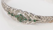 An Art Deco 18ct white gold and emerald bracelet, 20th century, stamped "750", maker's marks illegible, 23.5 grams - 2