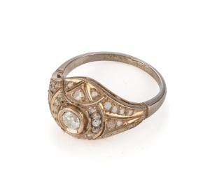 An Art Deco 18ct white and yellow gold ring, set with brilliant cut white diamonds, 2.7 grams