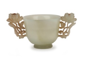 A rare antique Chinese carved jade cup with peony handles and coral adornments, 17th/18th century, ​​​​​​​5cm high, 9.5cm wide