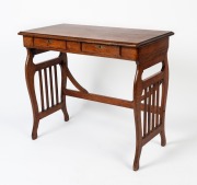 An antique French oak collapsible writing table with lyre trestle ends and two drawers, circa 1900, ​​​​​​​72cm high, 82cm wide, 45cm deep