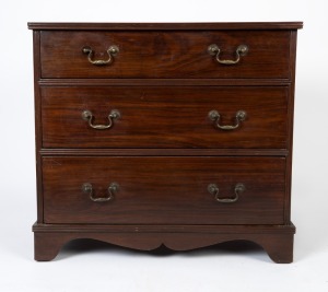 An antique Anglo-Ceylonese padouk chest of three graduated drawers with original brass carry handles, early to mid 19th century, 79cm high, 86cm wide, 50cm deep
