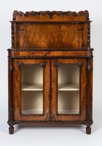 An antique English figured walnut chiffonier with full length carved columns and carved back, 19th century, 132cm high, 94cm wide, 41cm deep