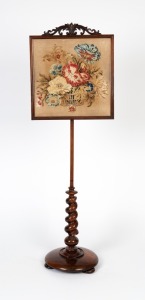 An antique English rosewood pole screen with circular base and barley twist column, 19th century, 146cm high