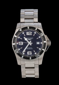 LONGINES "HYDROCONQUEST" automatic stainless steel wristwatch with black dial and rotating bezel, in original box with papers and additional link, near mint condition, 4.7cm wide including crown