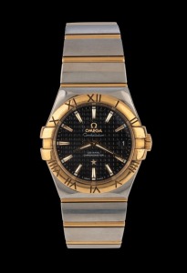 OMEGA "CONSTELLATION" Co-Axial chronometer wristwatch in stainless steel and 18ct gold case with machined black dial and date window, in original box with papers and additional link, 3.8cm wide including crown