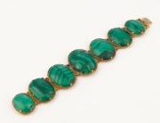 An antique 22ct gold bracelet, set with seven graduated polished malachite stones, housed in original plush fitted leather box, early to mid 19th century, ​​​​​​​17cm long - 2