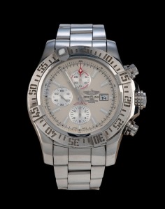 BREITLING automatic chronograph wristwatch in stainless steel case with off-white dial, date window and baton numerals, with original box, papers and additional brown leather strap with buckle, 5.4cm wide including crown