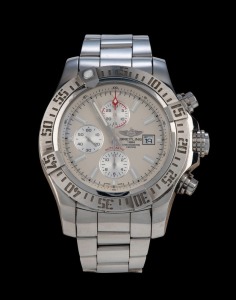 BREITLING automatic chronograph wristwatch in stainless steel case with off-white dial, date window and baton numerals, with original box, papers and additional brown leather strap with buckle, 5.4cm wide including crown