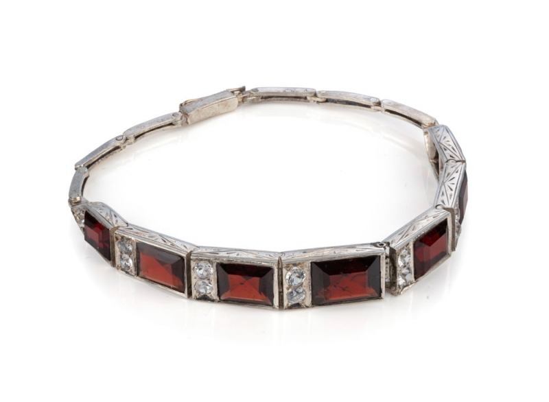 An Art Deco 18ct white gold, diamond and garnet bracelet, circa 1930s, 17cm long, 12.5 grams