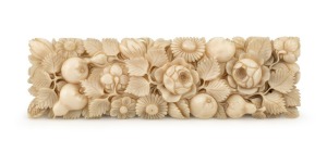 An antique ivory buckle, beautifully carved with floral decoration, 19th century, 9cm high