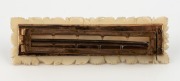 An antique ivory buckle, beautifully carved with floral decoration, 19th century, ​​​​​​​9cm high - 2