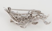 A vintage 18ct white gold foliate brooch, set&nbsp;with brilliant cut white diamonds and two rows of rubies, mid 20th century, ​​​​​​​4.6cm wide, 7.1 grams - 2