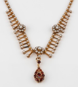 An antique 15ct yellow gold necklace, set with seed pearls and garnet pendant drop, 19th/20th century, 38cm long, 19.2 grams