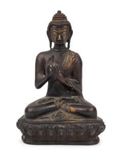 An antique Tibetan seated bronze Buddha statue with remains of silver and gilt decoration, 18th/19th century, 14cm high