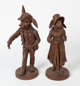 A pair of reproduction painted cast iron rabbit garden statues, the larger 71cm high