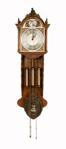 A vintage Friesian style wall clock, with weight driven movement chiming on gong rods, manufactured by EUROBELL, 20th century, 135cm high