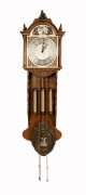 A vintage Friesian style wall clock, with weight driven movement chiming on gong rods, manufactured by EUROBELL, 20th century, 135cm high