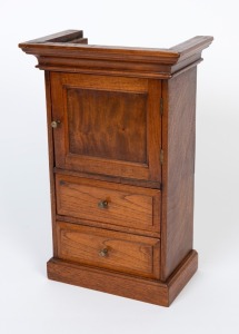 An Australian cedar and pine miniature single door cabinet with two drawers, 20th century, ​​​​​​​55cm high, 36cm wide, 22cm deep