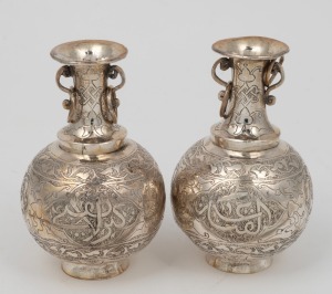 A pair of Indo-Persian silver posy vases with calligraphic engraved decoration, 20th century, 9cm high, 135 grams total