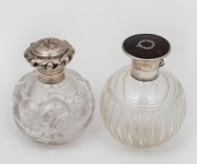 Two antique silver mounted vanity bottles, one example with tortoiseshell top, 19th century, the larger 11cm high