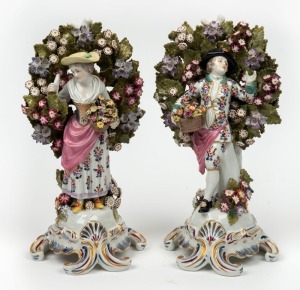 A pair of Continental floral porcelain statues in the 18th century English style, 20th century, 28cm high