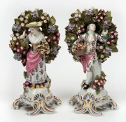 A pair of Continental floral porcelain statues in the 18th century English style, 20th century, ​​​​​​​28cm high