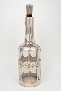 An antique silver overlay decanter with stopper, 19th/20th century, stamped "STERLING SILVER", 30cm high