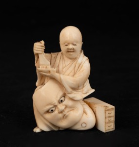 An antique Japanese carved ivory Okimono figure of the mask decorator, Meiji period 19th/20th century, 7.5cm high