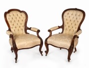 Two antique English walnut salon chairs with jacquard upholstery and carved frames, 19th century, ​​​​​​​the larger 98cm high, 68cm across the arms