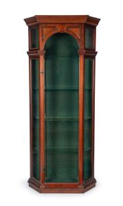 An antique English mahogany display cabinet with unusual drop-in door mechanism, metal shelf racking and chamfered sides, late 19th century, 204cm high, 89cm wide, 28cm deep