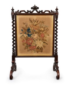 An antique English rosewood fire screen with barley twist columns and original floral tapestry insert, mid 19th century, 117cm high, 77cm wide, 44cm deep
