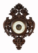 An impressive antique French aneroid wall barometer with exposed movement, housed in carved walnut surround, dial marked "Mon. LOISEAE. BOUCHAR, Sr. 35. QUAI DE L'HORLOGE, PARIS", 19th century, 91 x 62cm overall