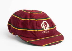 QUEENSLAND COLTS CRICKET CAP, maroon with green & gold horizontal stripes, Embroidered "QCA/ COLTS" on front. Good match-used condition.