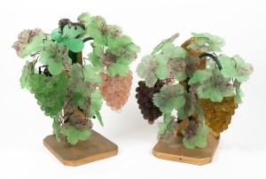 A pair of vintage Murano glass wall sconce lights with bunches of hanging grapes, early to mid 20th century, mounted on later wooden stands, 40cm high overall