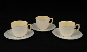 BELLEEK Irish porcelain set of three demi-tasse coffee cups and saucers, green factory marks, the saucers 11.5cm diameter